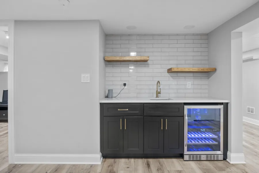 Basement With Wet Bar And Fireplace